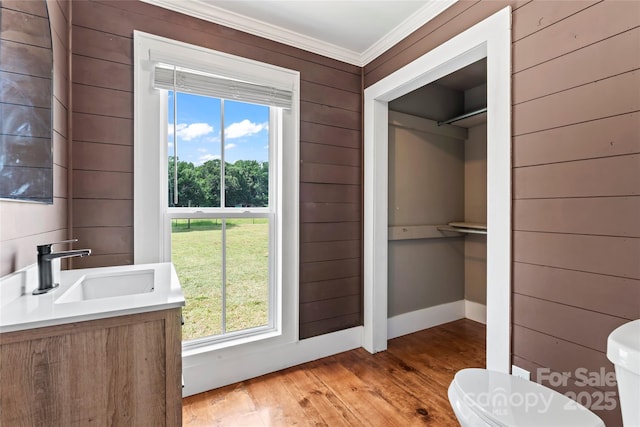 233 Sellars Rd, Kings Mountain, NC 28086 - half bath featuring hardwood / wood-style flooring, ornamental molding, toilet, vanity, and wood walls