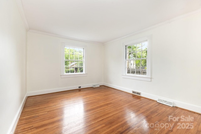 1400 Matheson Ave, Charlotte, NC 28205 - empty room with wood finished floors, baseboards, and crown molding