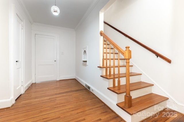1400 Matheson Ave, Charlotte, NC 28205 - staircase with wood finished floors, crown molding, and baseboards