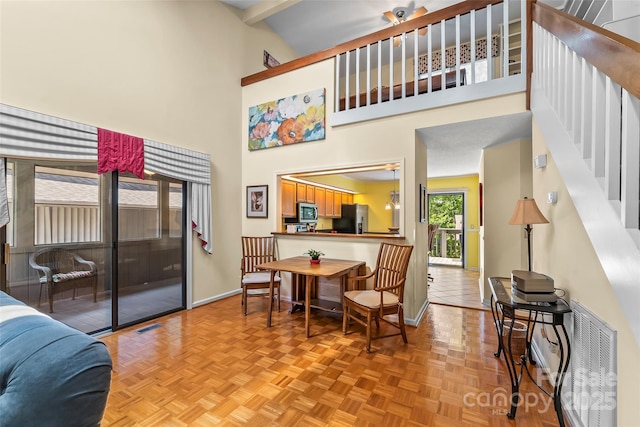 903 Independence Trl, Morganton, NC 28655 - living area featuring baseboards, stairs, and a towering ceiling
