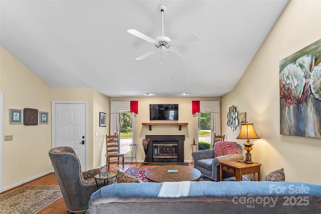 903 Independence Trl, Morganton, NC 28655 - living area with a fireplace with flush hearth, ceiling fan, baseboards, and wood finished floors