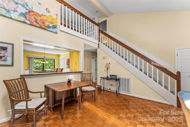 903 Independence Trl, Morganton, NC 28655 - staircase featuring a chandelier, a high ceiling, and baseboards