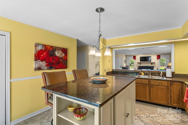 903 Independence Trl, Morganton, NC 28655 - kitchen with a sink, a kitchen island, open shelves, a ceiling fan, and a textured ceiling