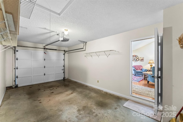 903 Independence Trl, Morganton, NC 28655 - garage featuring a garage door opener and baseboards