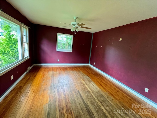 8 Mountain Ter, Asheville, NC 28806 - spare room featuring wood-type flooring, ceiling fan, and baseboards