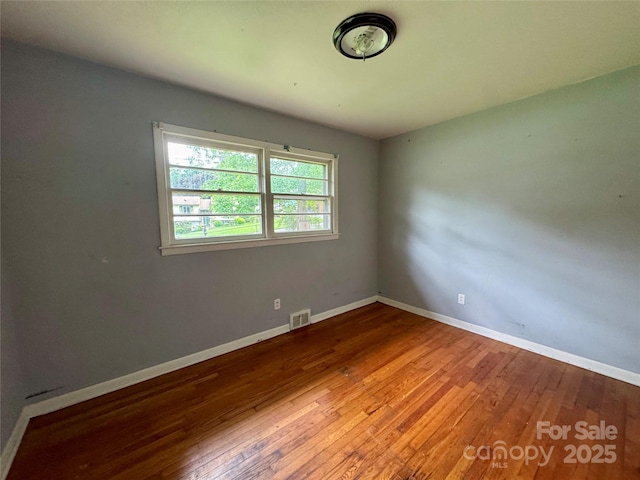 8 Mountain Ter, Asheville, NC 28806 - unfurnished room featuring wood-type flooring and baseboards