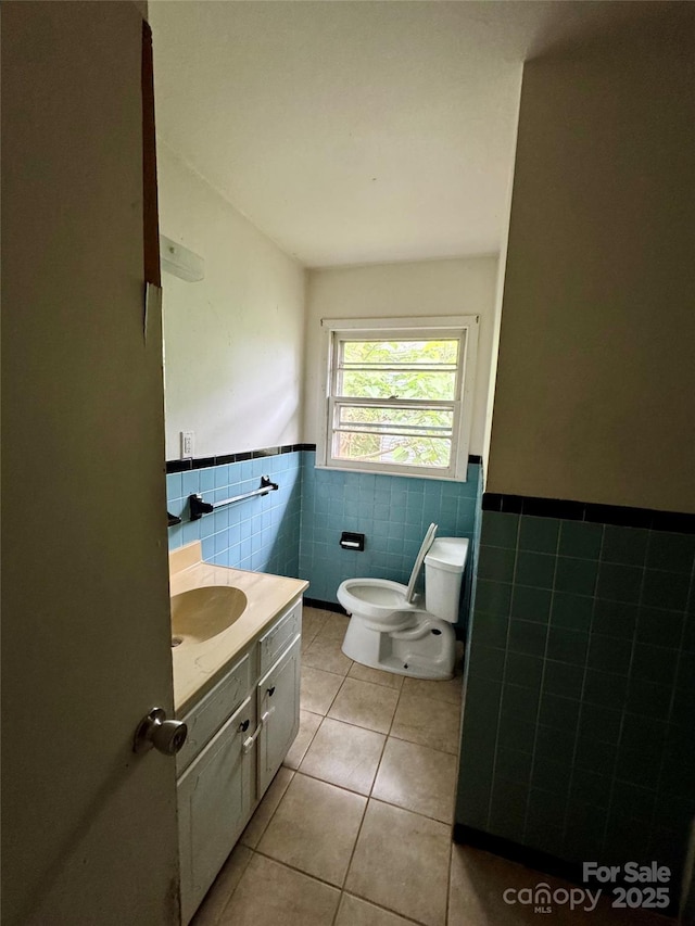 8 Mountain Ter, Asheville, NC 28806 - bathroom featuring tile walls, tile patterned floors, vanity, wainscoting, and toilet