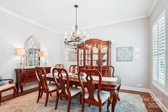 5424 Morris Hunt Dr, Fort Mill, SC 29708 - dining room with a chandelier, wood finished floors, ornamental molding, and baseboards