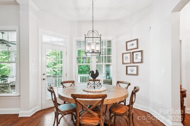 5424 Morris Hunt Dr, Fort Mill, SC 29708 - dining space with dark wood-type flooring, a chandelier, and baseboards