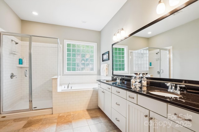 5424 Morris Hunt Dr, Fort Mill, SC 29708 - bathroom featuring double vanity, a garden tub, a shower stall, and tile patterned flooring