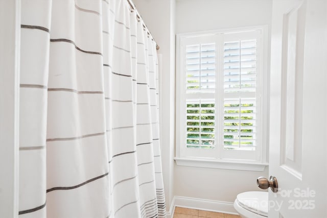 5424 Morris Hunt Dr, Fort Mill, SC 29708 - bathroom featuring toilet, tile patterned flooring, baseboards, and curtained shower