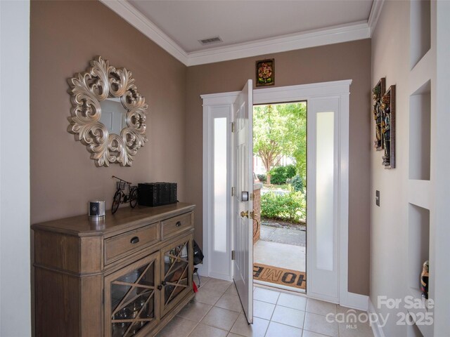 1410 Kenton Ln, Asheville, NC 28803 - foyer featuring ornamental molding, light tile patterned floors, and baseboards