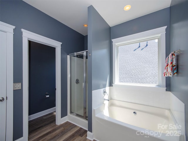 1410 Kenton Ln, Asheville, NC 28803 - bathroom featuring a bath, wood finished floors, a stall shower, and baseboards