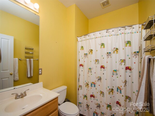 1410 Kenton Ln, Asheville, NC 28803 - full bathroom with toilet, vanity, and a shower with shower curtain