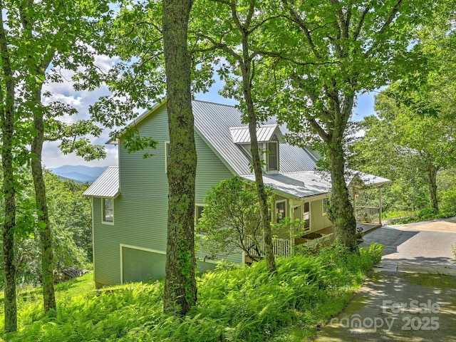 58 Randall Dr, Fairview, NC 28730 - view of property exterior featuring metal roof and a standing seam roof