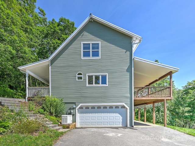 58 Randall Dr, Fairview, NC 28730 - view of home's exterior with asphalt driveway, a garage, and stairway