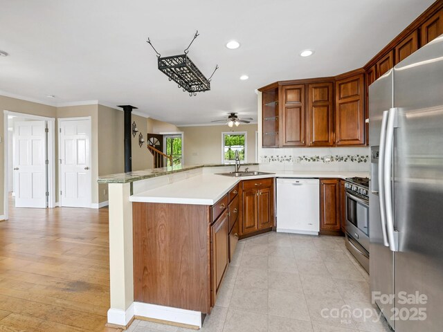 58 Randall Dr, Fairview, NC 28730 - kitchen featuring stainless steel appliances, a sink, a peninsula, recessed lighting, and a ceiling fan
