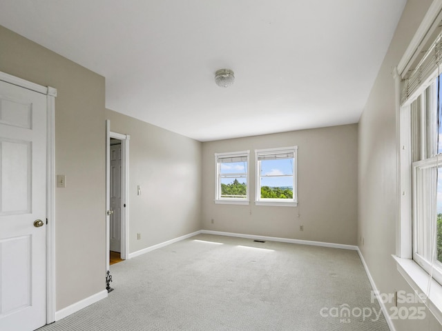 58 Randall Dr, Fairview, NC 28730 - unfurnished bedroom with carpet and baseboards