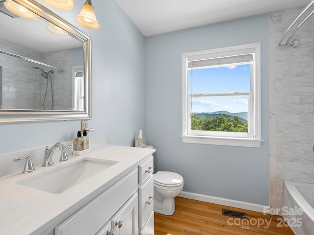 58 Randall Dr, Fairview, NC 28730 - full bath featuring vanity, toilet, wood finished floors, baseboards, and shower / bath combination