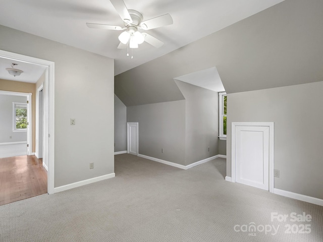 58 Randall Dr, Fairview, NC 28730 - additional living space featuring a ceiling fan, light colored carpet, baseboards, and lofted ceiling