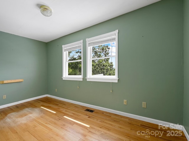 58 Randall Dr, Fairview, NC 28730 - unfurnished room featuring baseboards and light wood-type flooring