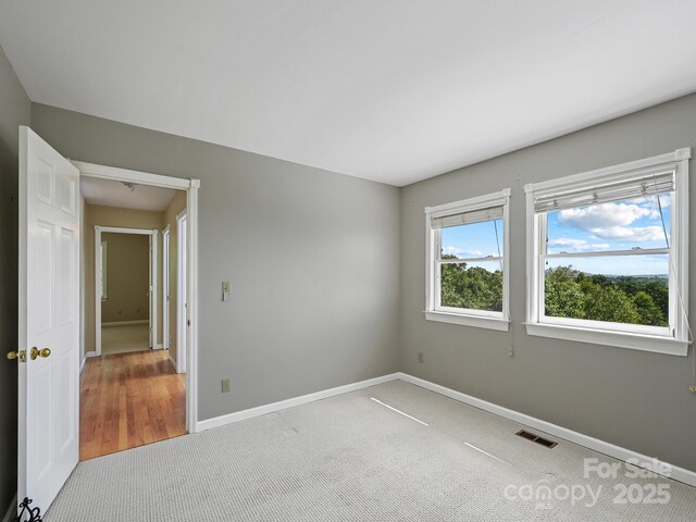 58 Randall Dr, Fairview, NC 28730 - carpeted empty room featuring baseboards