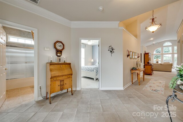 539 Turquoise Way, Fort Mill, SC 29708 - hallway featuring ornamental molding, baseboards, lofted ceiling, and light tile patterned floors