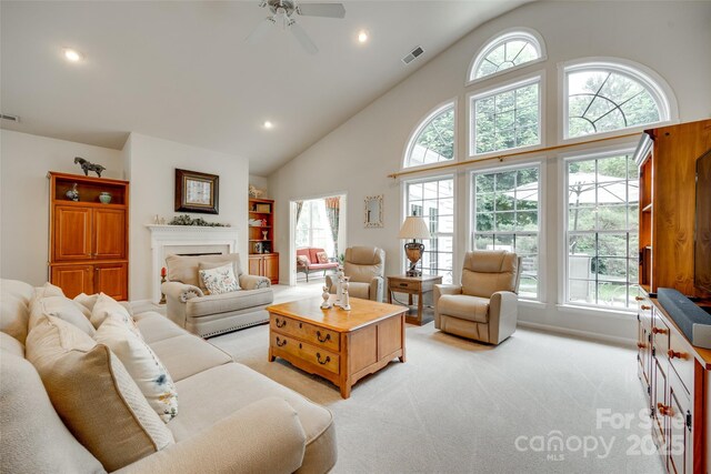 539 Turquoise Way, Fort Mill, SC 29708 - living area with light carpet, a ceiling fan, high vaulted ceiling, recessed lighting, and a fireplace
