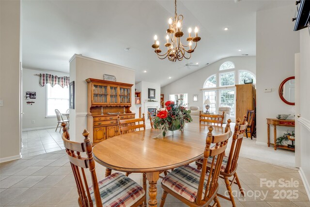 539 Turquoise Way, Fort Mill, SC 29708 - dining area with vaulted ceiling, healthy amount of natural light, light tile patterned floors, a chandelier, and baseboards