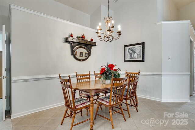 539 Turquoise Way, Fort Mill, SC 29708 - dining space featuring light tile patterned flooring, a chandelier, a towering ceiling, and baseboards
