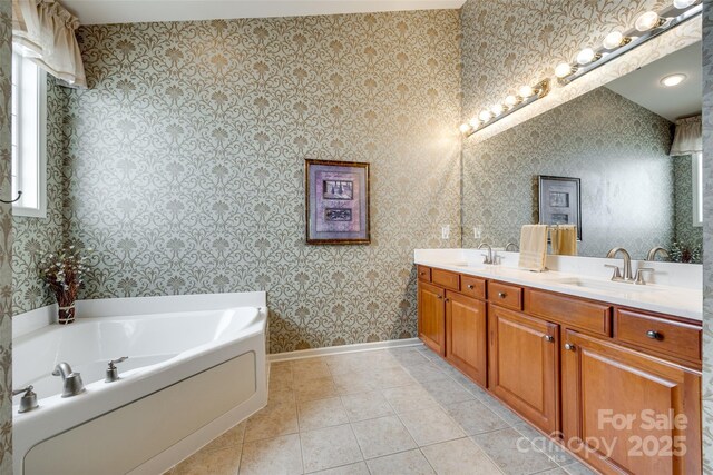 539 Turquoise Way, Fort Mill, SC 29708 - full bathroom featuring double vanity, a garden tub, baseboards, wallpapered walls, and tile patterned flooring