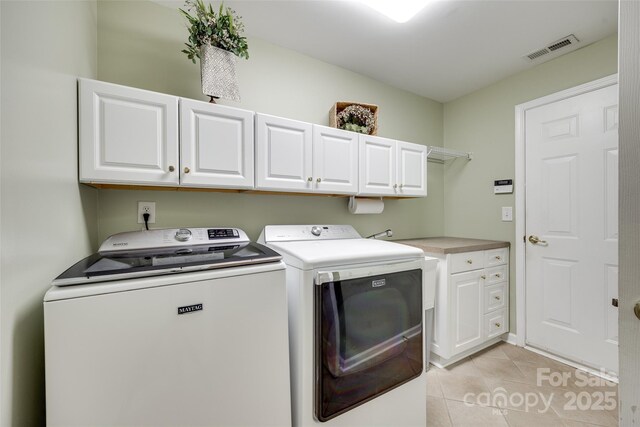 539 Turquoise Way, Fort Mill, SC 29708 - laundry area featuring cabinet space, washer and clothes dryer, and light tile patterned floors