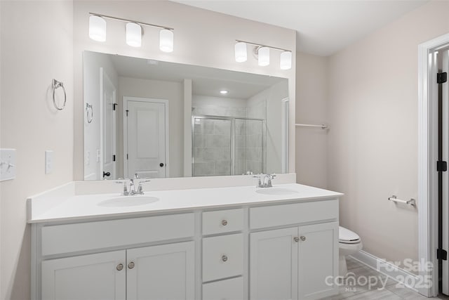6712 W Sugar Creek Rd, Charlotte, NC 28269 - full bath featuring toilet, double vanity, a shower stall, and baseboards