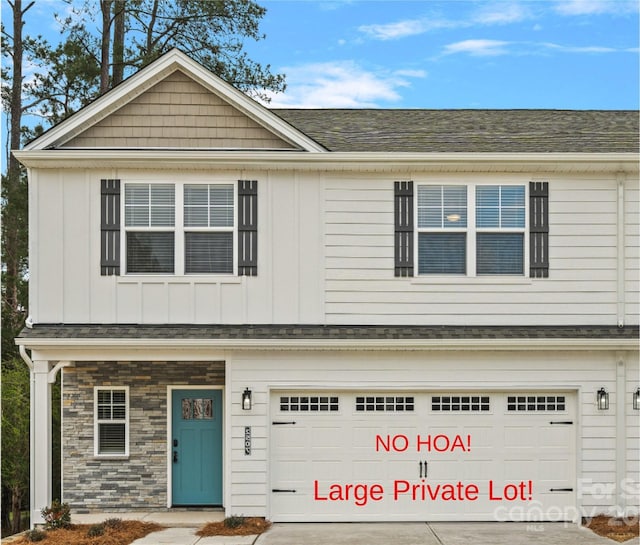 6712 W Sugar Creek Rd, Charlotte, NC 28269 - view of front of house with an attached garage, driveway, board and batten siding, and stone siding