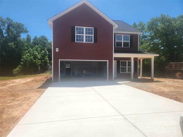 2300 Grayson Pkwy, Monroe, NC 28110 - view of front facade featuring driveway, an attached garage, and covered porch