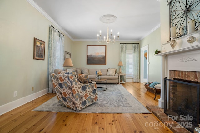 420 S Cedar St, Lincolnton, NC 28092 - living room featuring a fireplace, healthy amount of natural light, a chandelier, ornamental molding, and wood-type flooring