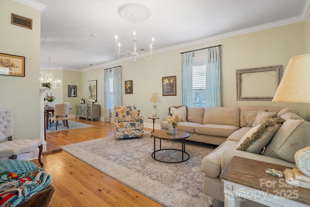 420 S Cedar St, Lincolnton, NC 28092 - living area with a chandelier, wood finished floors, crown molding, and baseboards