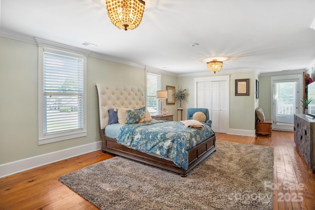 420 S Cedar St, Lincolnton, NC 28092 - bedroom with ornamental molding, hardwood / wood-style floors, baseboards, and a closet