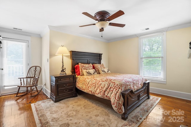 420 S Cedar St, Lincolnton, NC 28092 - bedroom with crown molding, wood-type flooring, baseboards, and a ceiling fan