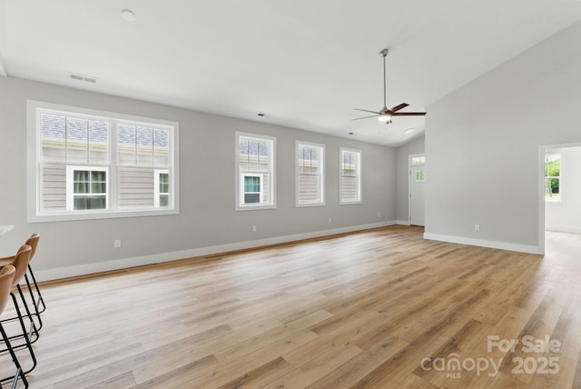 192 Plato Pl, Etowah, NC 28729 - unfurnished living room with ceiling fan, light wood-type flooring, plenty of natural light, and lofted ceiling
