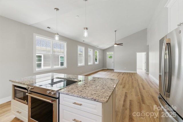 192 Plato Pl, Etowah, NC 28729 - kitchen with appliances with stainless steel finishes, light wood-type flooring, baseboards, ceiling fan, and white cabinets