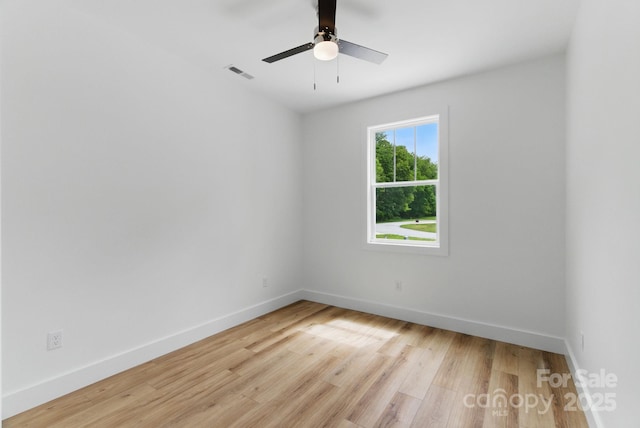192 Plato Pl, Etowah, NC 28729 - empty room featuring light wood-style floors, baseboards, and a ceiling fan