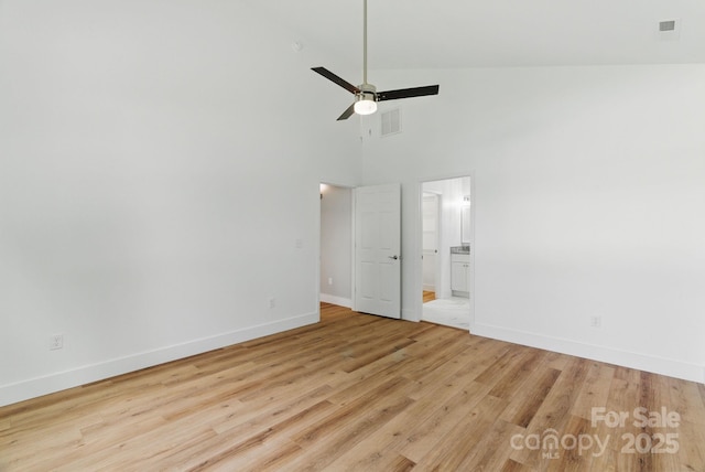 192 Plato Pl, Etowah, NC 28729 - empty room featuring baseboards, wood finished floors, a high ceiling, and ceiling fan