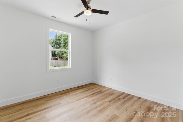 192 Plato Pl, Etowah, NC 28729 - spare room featuring light wood-style flooring, baseboards, and ceiling fan