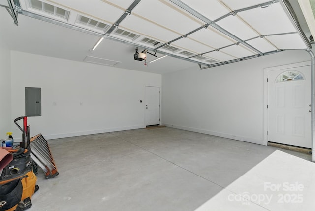 192 Plato Pl, Etowah, NC 28729 - garage featuring electric panel, baseboards, and a garage door opener