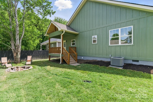 192 Plato Pl, Etowah, NC 28729 - rear view of property featuring central air condition unit, board and batten siding, an outdoor fire pit, a deck, and crawl space