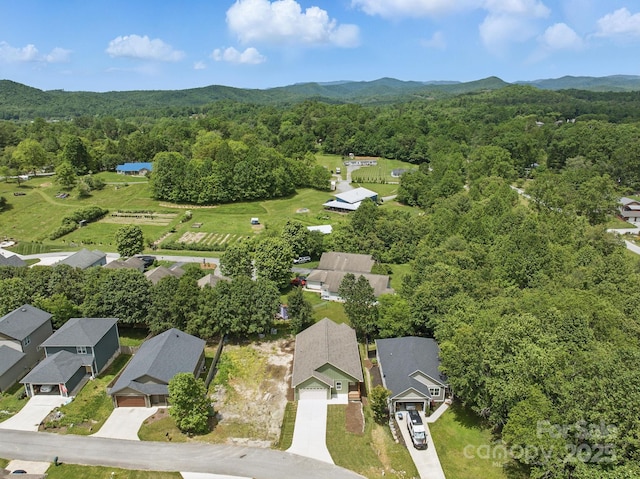 192 Plato Pl, Etowah, NC 28729 - aerial perspective of suburban area featuring a forest and mountains