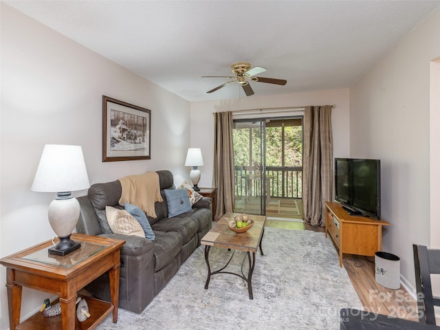 55 Lake Dr Unit 4P, Laurel Park, NC 28739 - living area featuring wood finished floors, ceiling fan, and baseboards