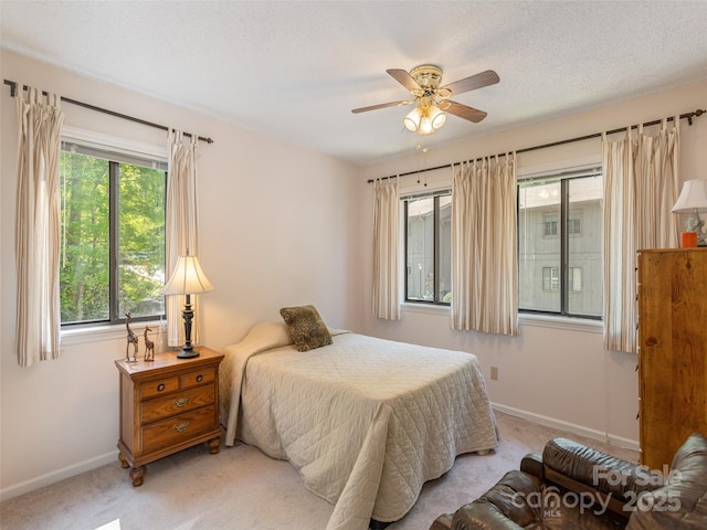 55 Lake Dr Unit 4P, Laurel Park, NC 28739 - bedroom with light carpet, baseboards, and a ceiling fan