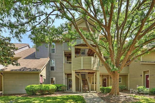 2533 Stockbridge Dr, Charlotte, NC 28210 - view of front facade featuring stairs and roof with shingles